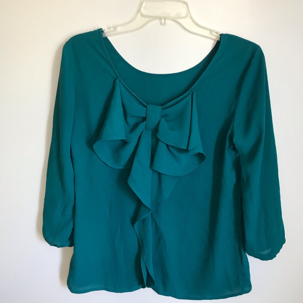 The limited emerald green bow blouse